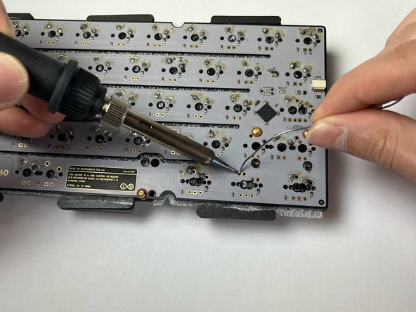 Soldering a switch onto the PCB
